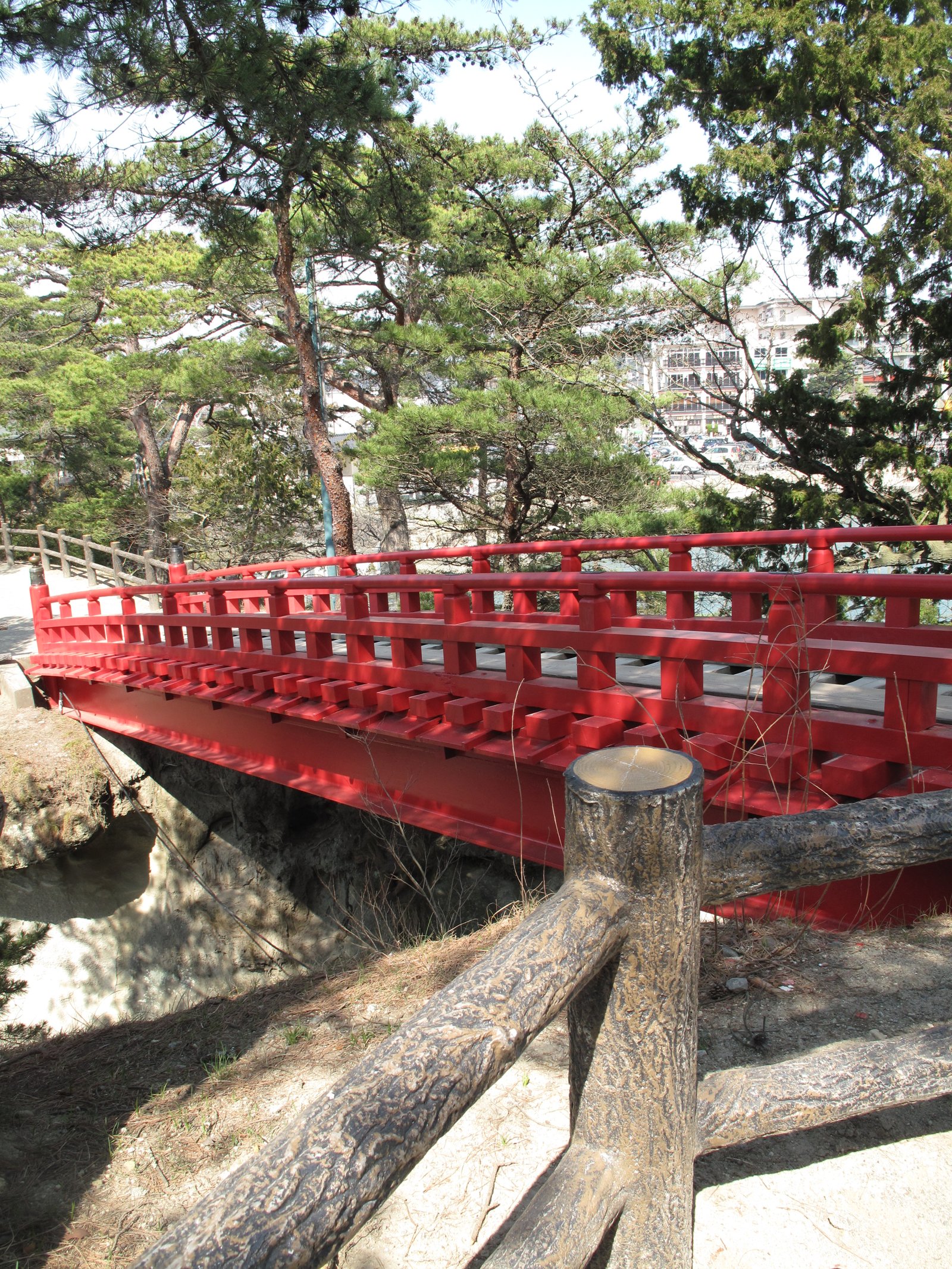 A red bridge seen from the island