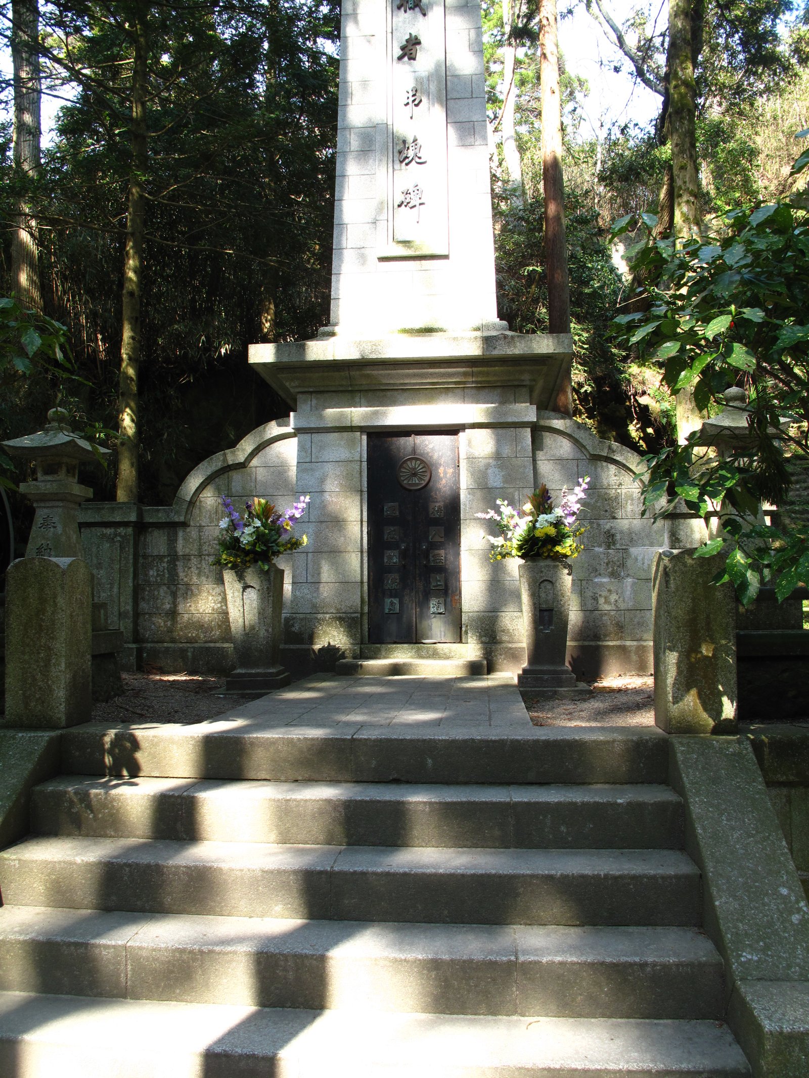 A stone monument at the top of stone steps