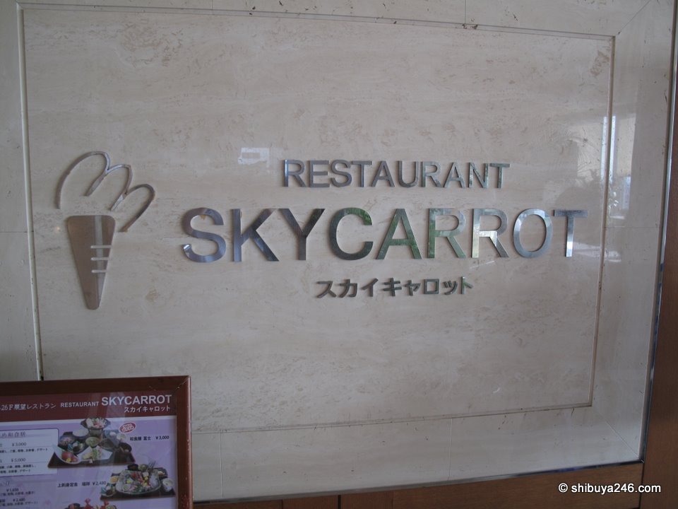 A glass sign reading Restaurant Sky Carrot