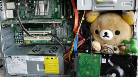 Rilakkuma helping fix my computer