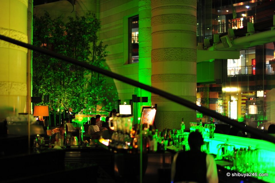 A bar lit in bright green light
