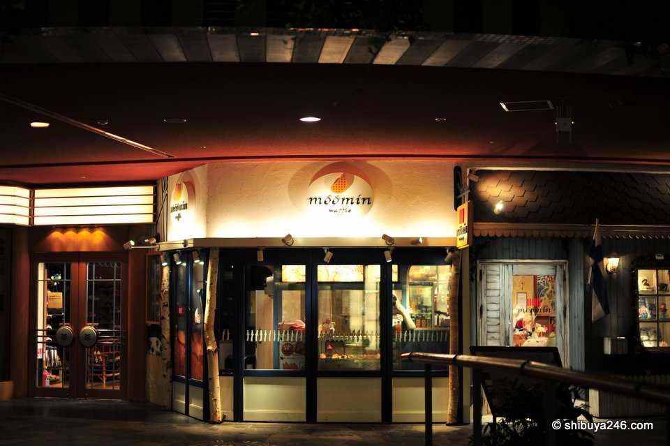 A restaurant front lit up at night