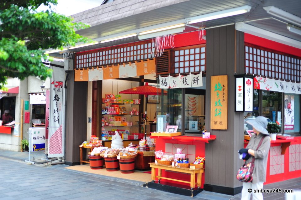 A shop with red displays of sweets and souvenirs