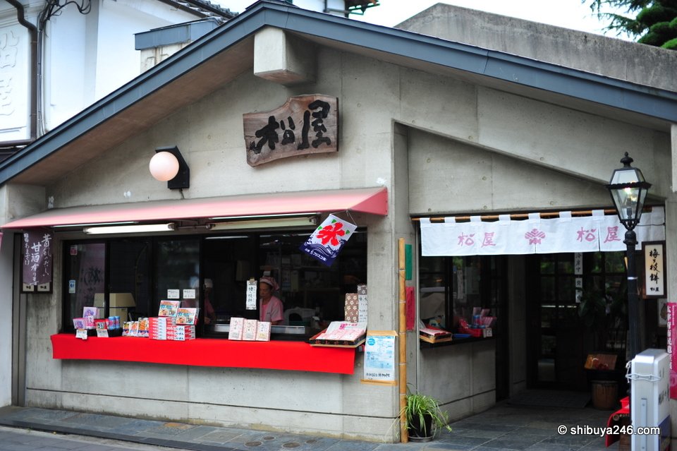 A small shop with a curved roof