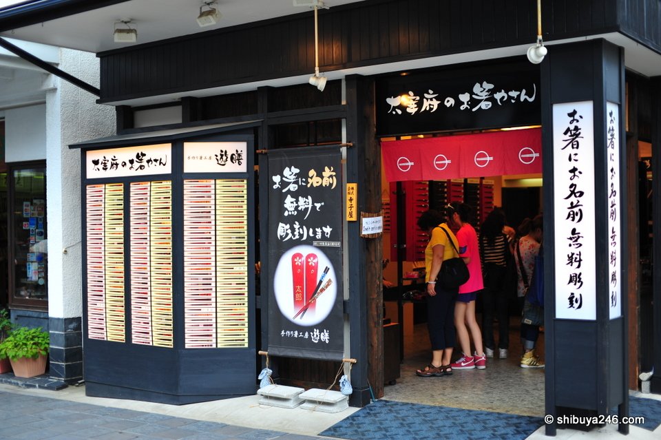 A dark shopfront with a white menu board