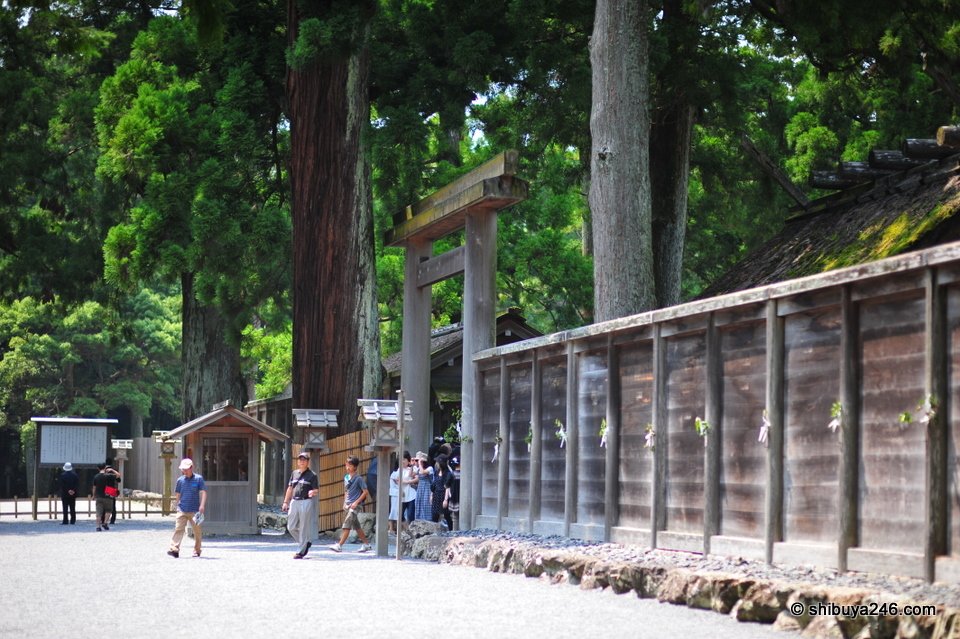 A long wooden fence beside a gravel path