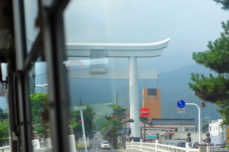 A huge torii seen through a bus window
