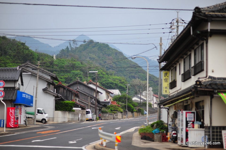 A small road with shops near the coast