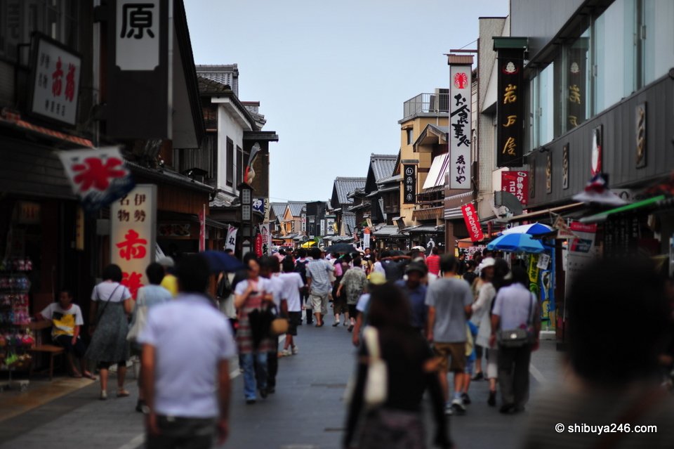 Shops and banners along a crowded old street