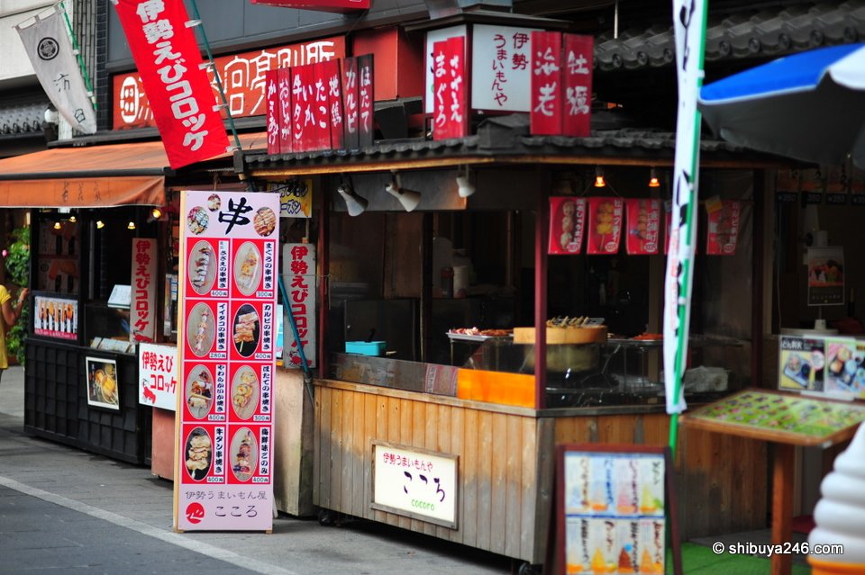 A street stall with red banners and snacks