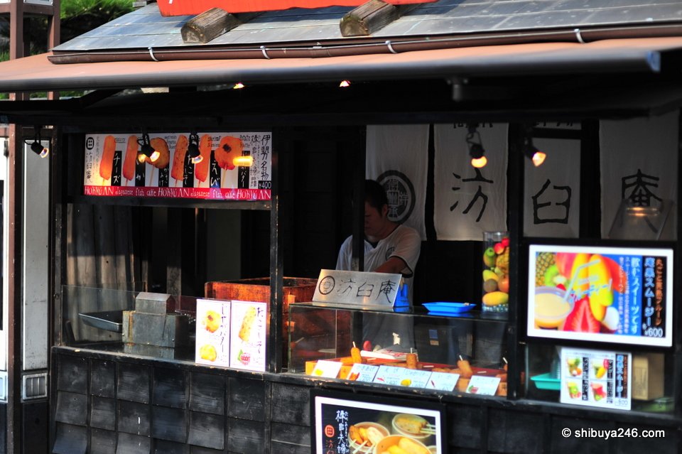 A shop counter with traditional signs and goods