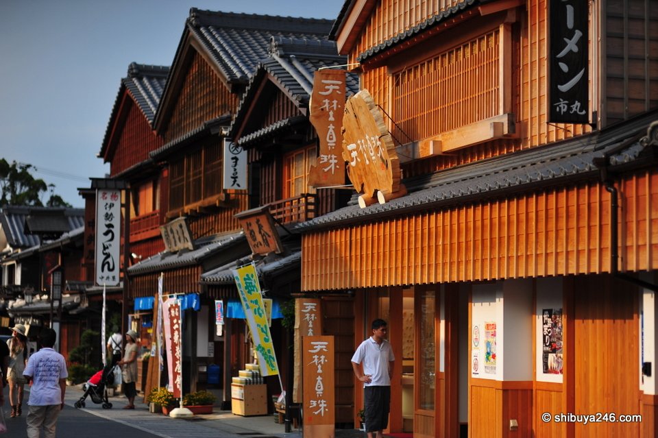 Wooden two-storey shop buildings along a street