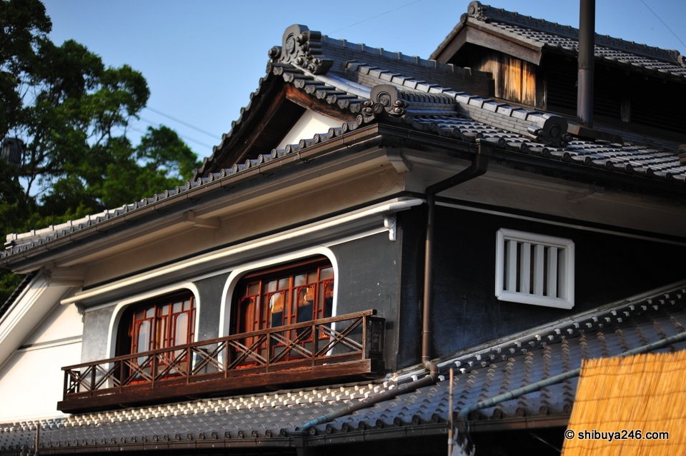 The wooden upper floor and balcony of an old building