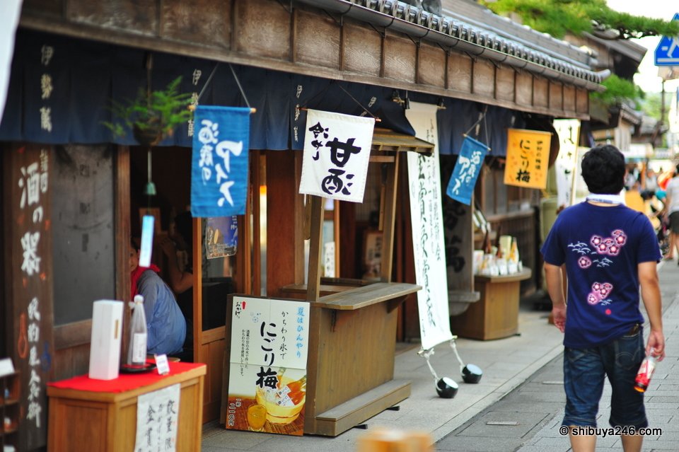 A street stall with banners and a menu board