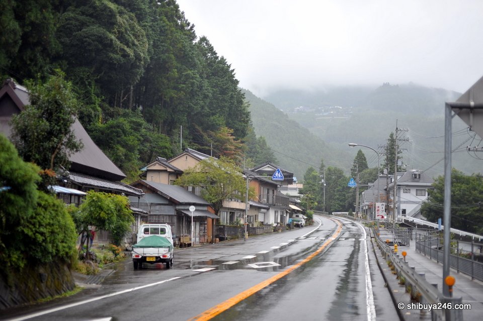 A rainy main street in a small mountain town