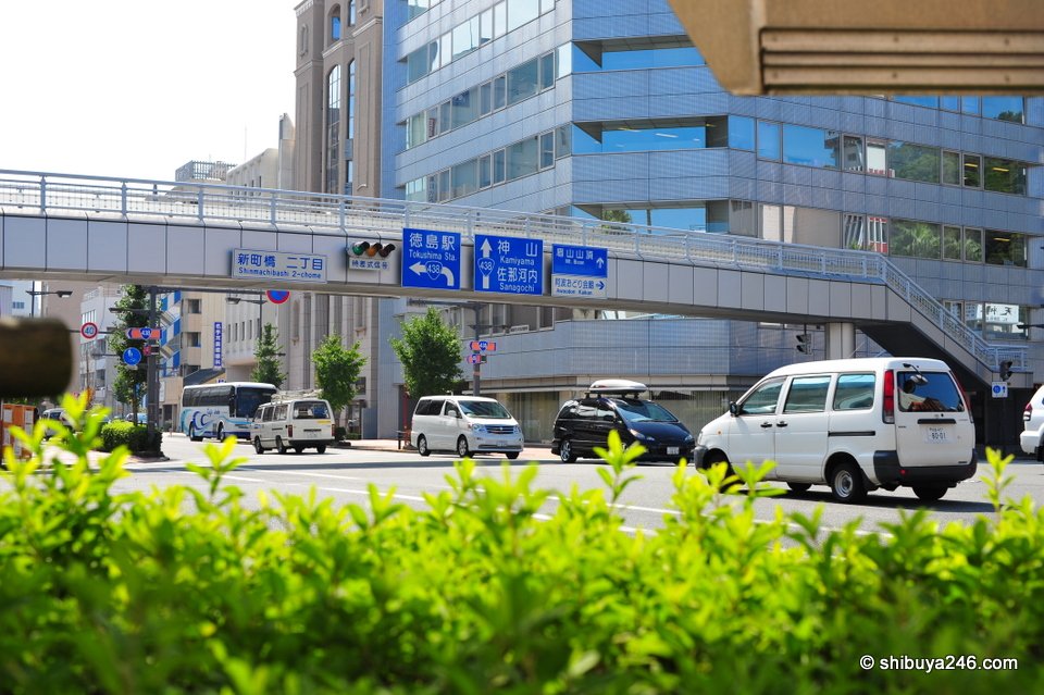 A wide road and footbridge in central Tokushima