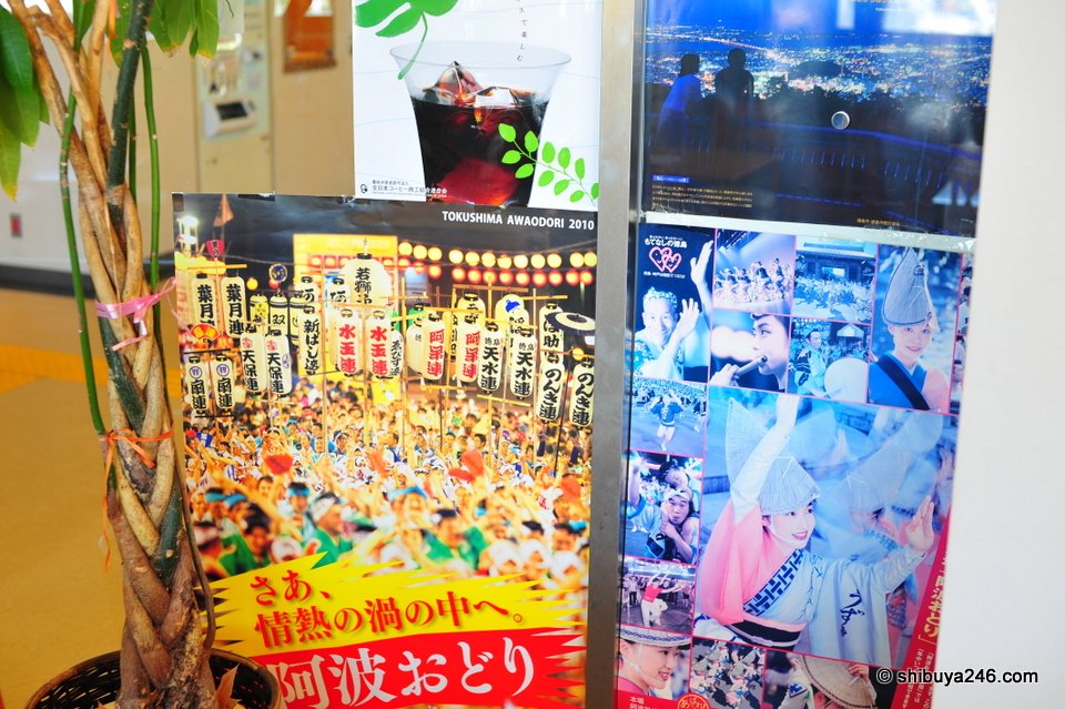 A display of Awa Odori posters and decorations