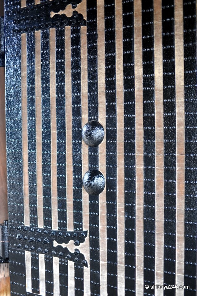 A black and white lattice on a castle gate