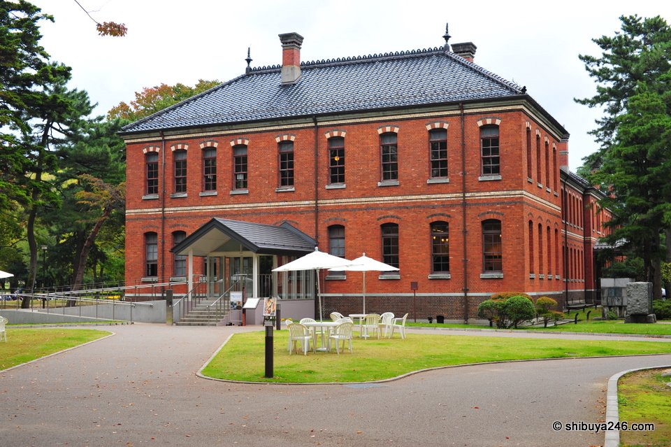 A red-brick building on a lawn