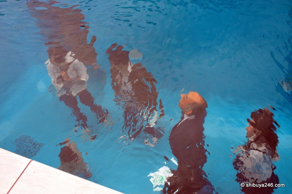 Looking down into a pool with people standing on the bottom