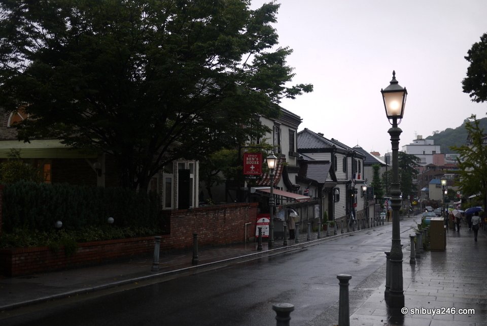 A sloping street with old-style street lamps