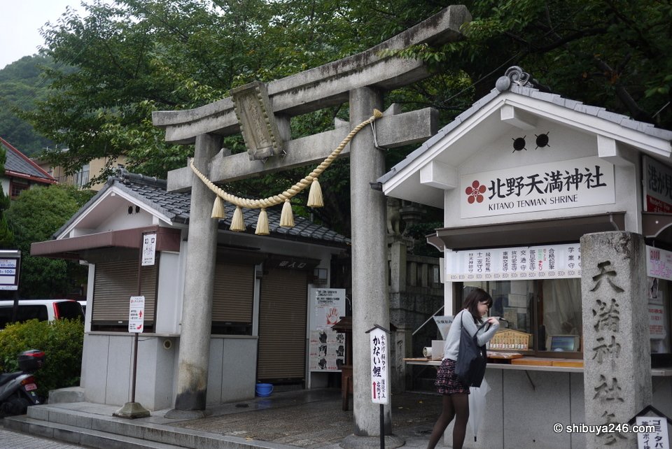 A stone torii and the entrance to a small shrine