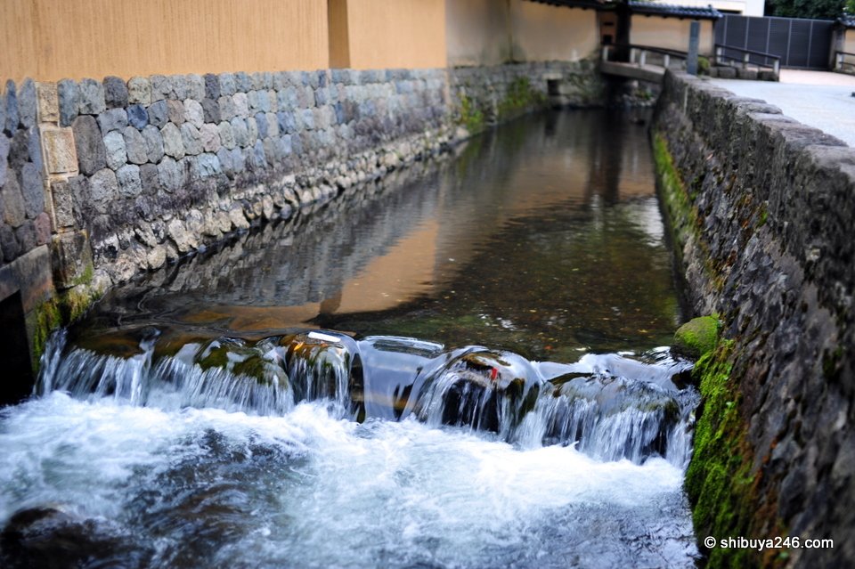 A small waterfall in a stone-lined canal