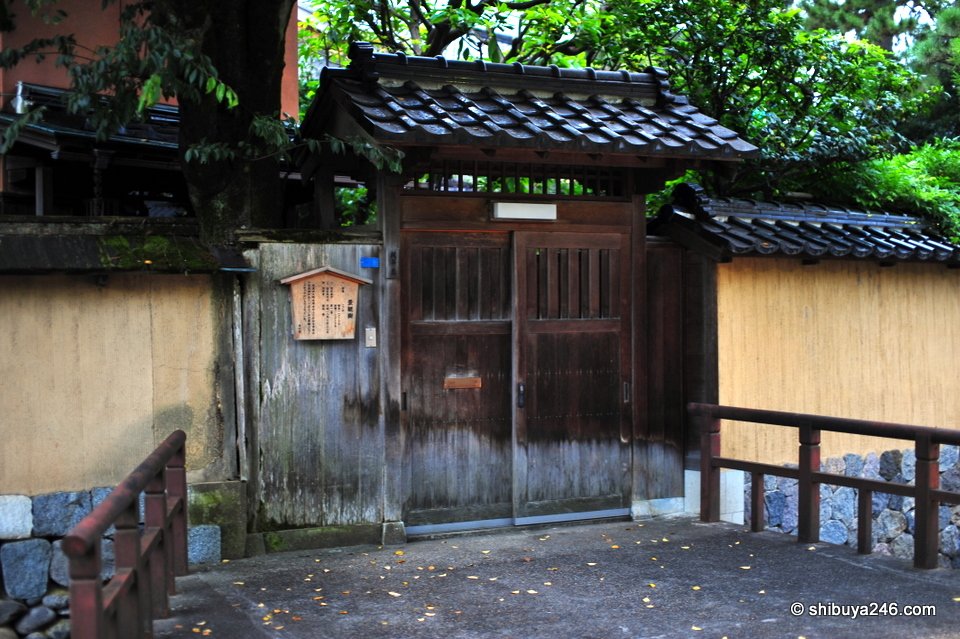 An old wooden gate in an earthen wall