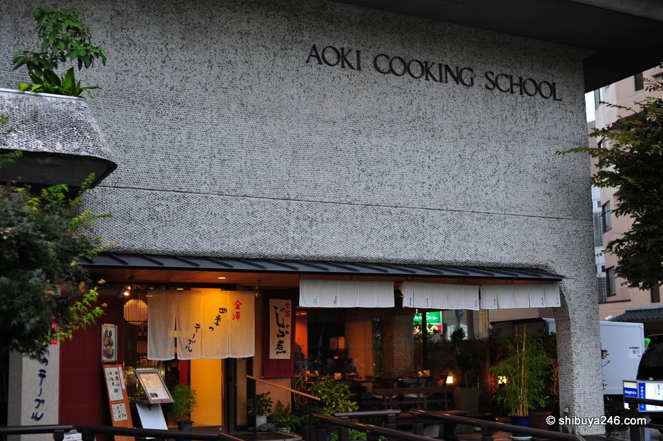 A building with a cooking school sign