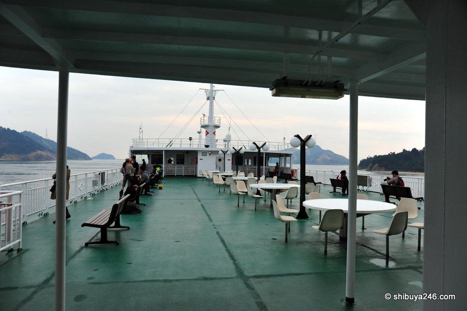 Benches and tables on an open ferry deck