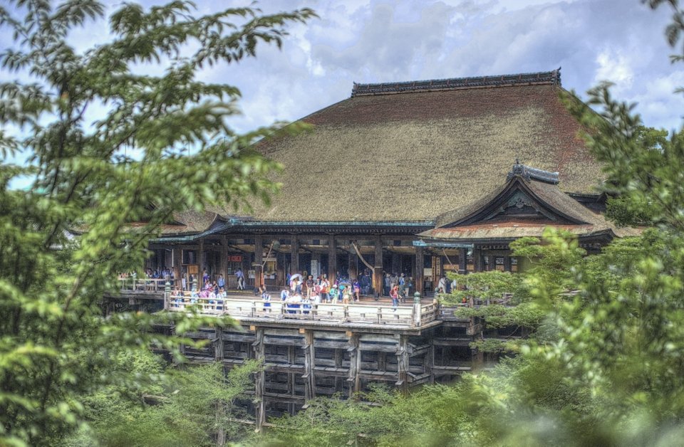 The main hall and its stage seen across the valley through trees