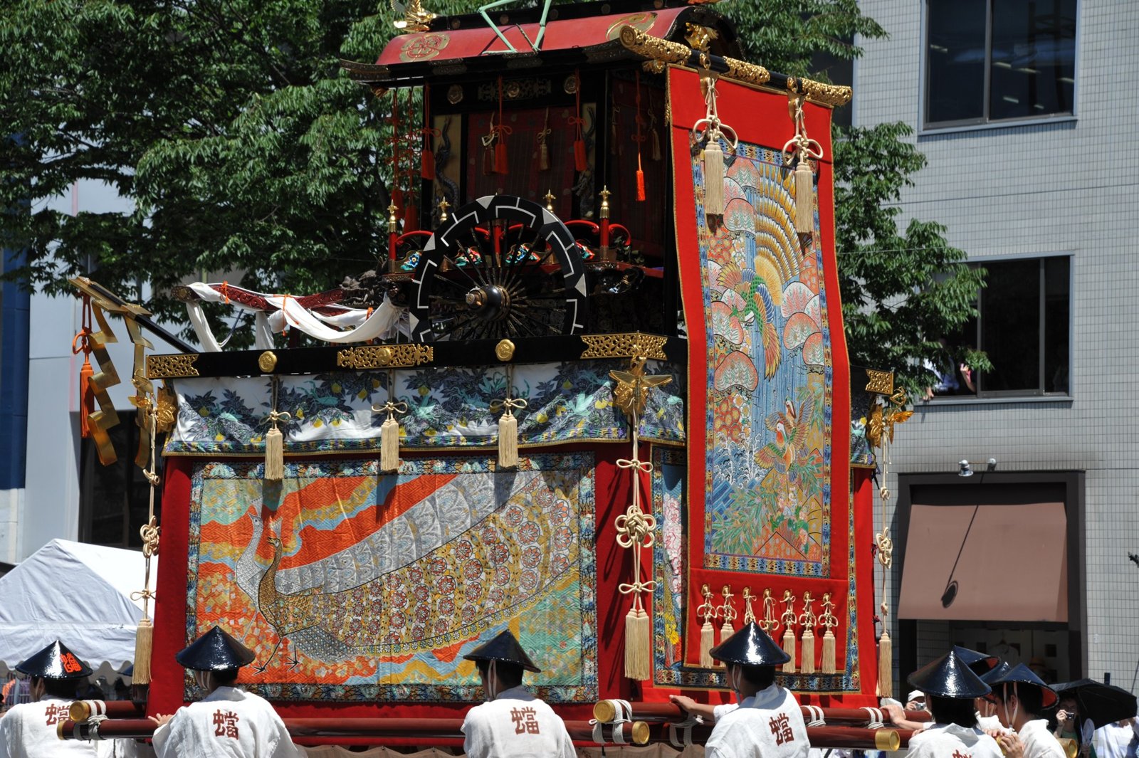 A float with a large hanging tapestry