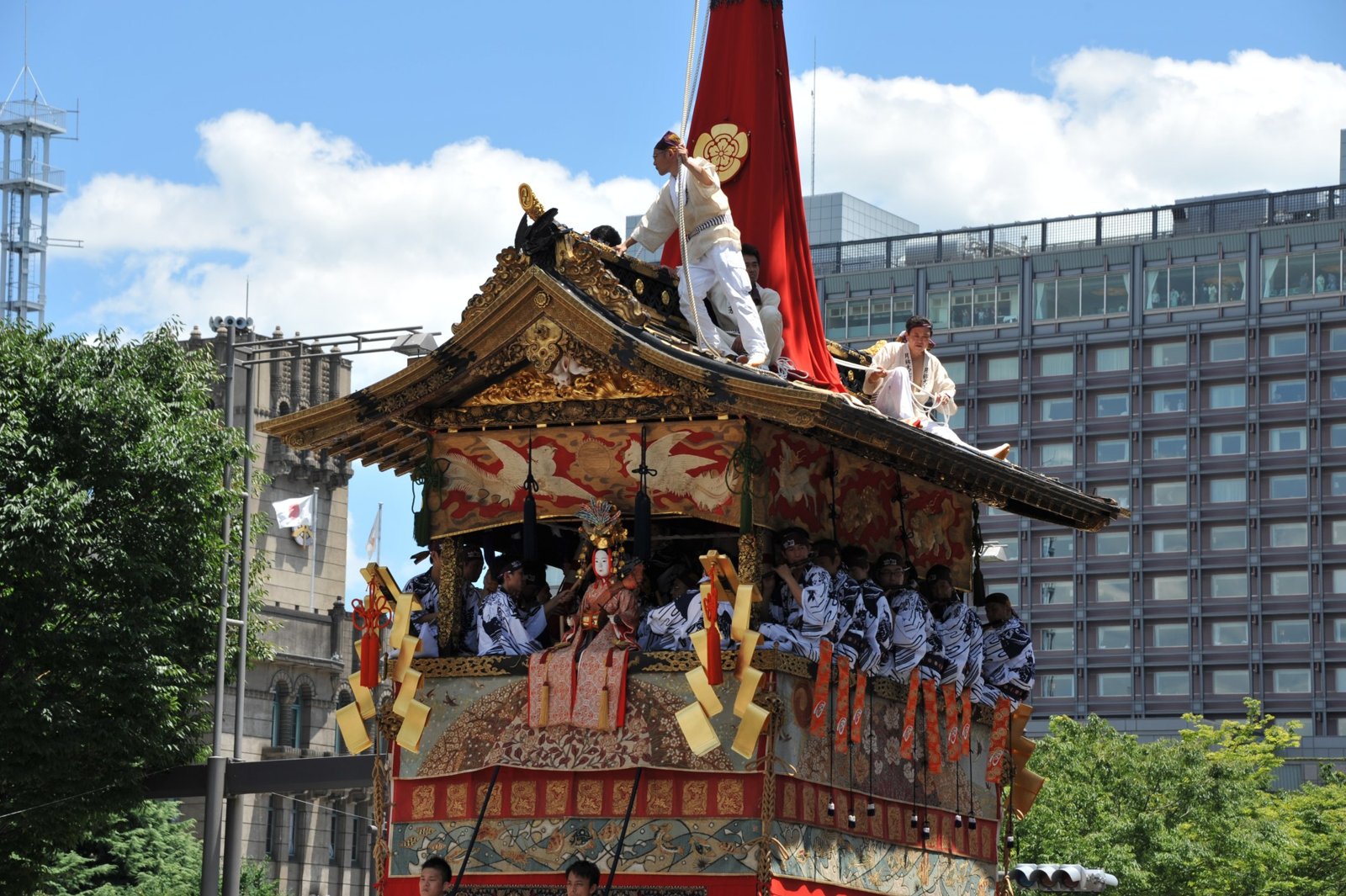 A float with men standing on its roof