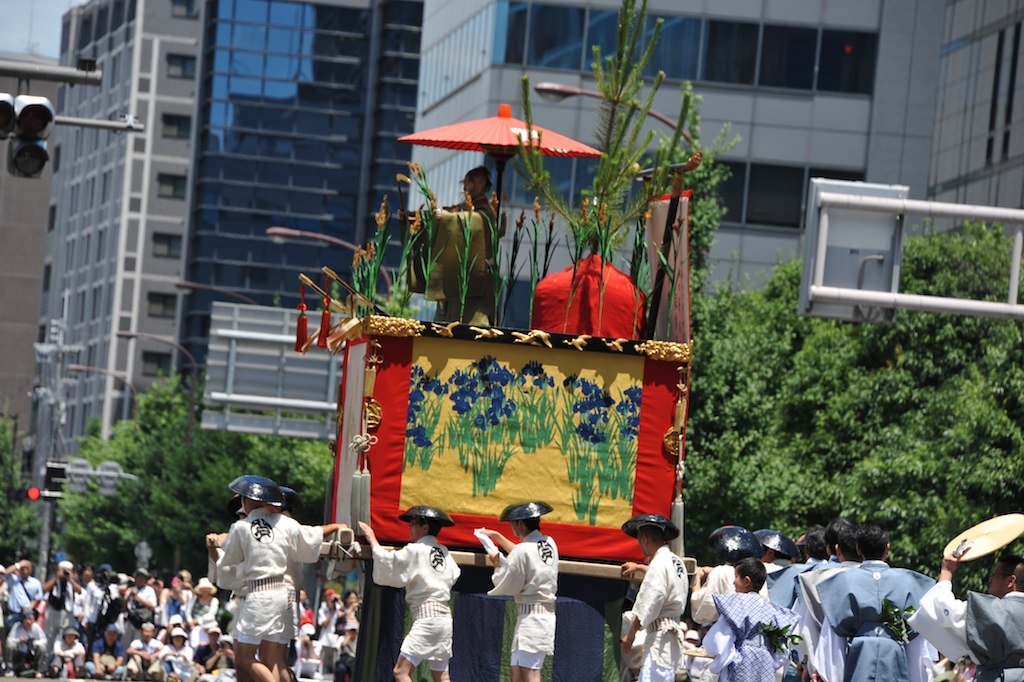 A float topped with green pine branches