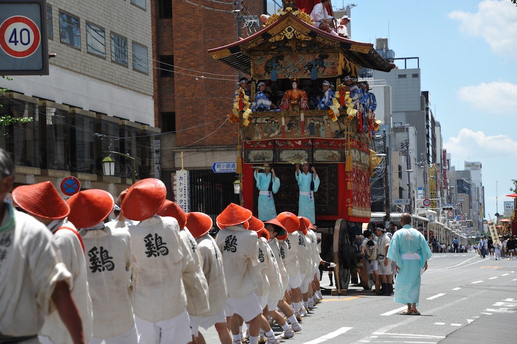 A group in red hats and white jackets walking