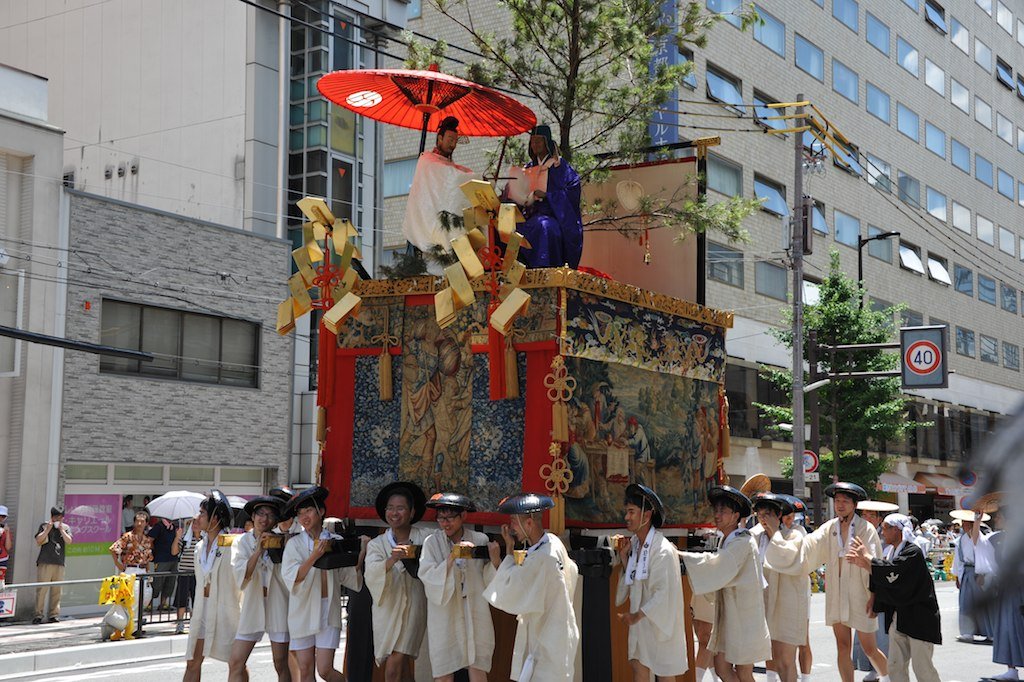 A yama float with its team around it