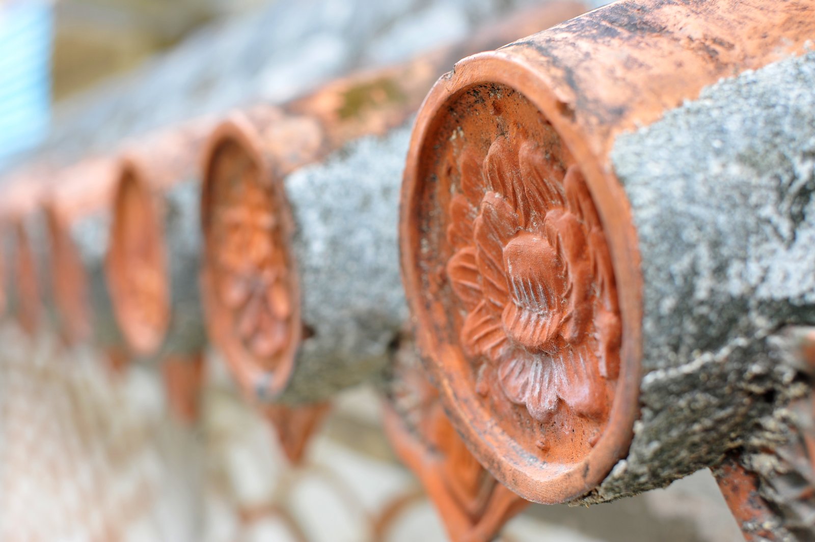 Close-up of round tile ends in a wall