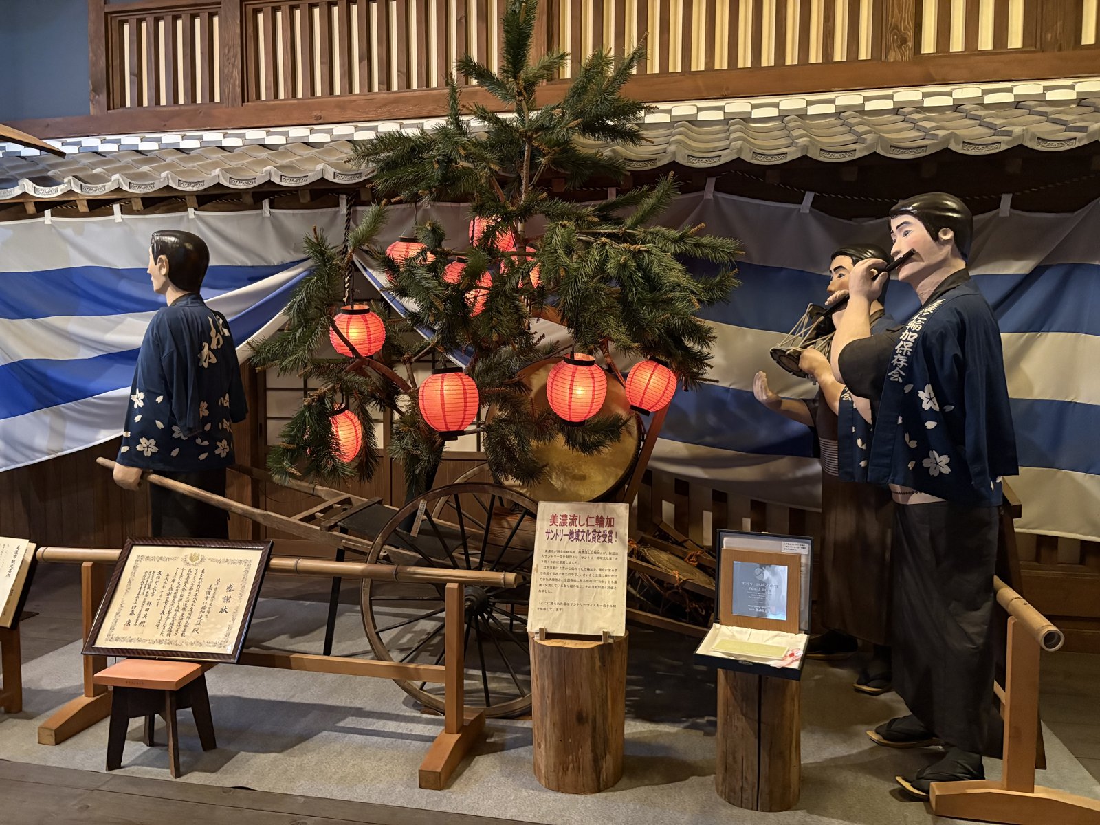 The Niwaka storehouse at the old Imai house, with a display on the town's Niwaka festival.