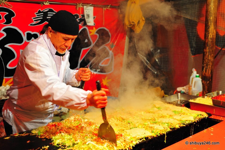 This is how you make Okonomiyaki. I am not sure how many servings I can count here, but they were disappearing fast as customers lined up.