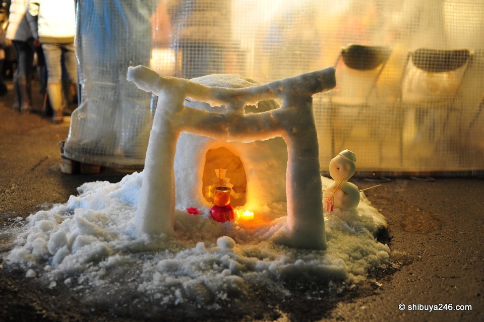A mini kamakura and shrine. Looks like it wont be long before the shrine melts.