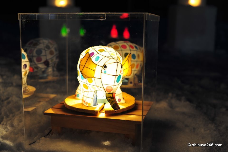 A decorated elephant lit up as part of the occasion.