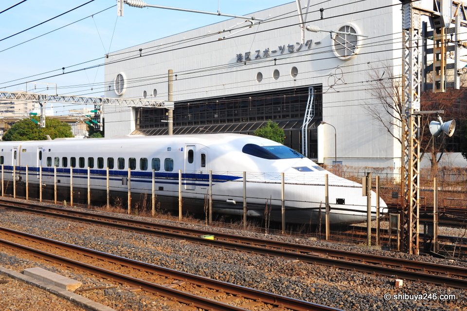 Shinkansen passes by the Minatoku sports center.